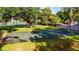Outdoor basketball court with mature trees is ready for a pick-up game at 604 Chestnut Oak Cir # 106, Altamonte Springs, FL 32701