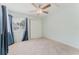 This bedroom features a ceiling fan and a window, and closet space at 604 Chestnut Oak Cir # 106, Altamonte Springs, FL 32701