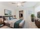Well-lit bedroom with carpet, ceiling fan, large window, closet and a decorative plant at 604 Chestnut Oak Cir # 106, Altamonte Springs, FL 32701