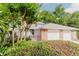 Charming townhome with lush landscaping, brick accents, and a two-car garage at 604 Chestnut Oak Cir # 106, Altamonte Springs, FL 32701