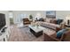 Bright living room with hardwood floors, modern furnishings and plenty of natural light at 604 Chestnut Oak Cir # 106, Altamonte Springs, FL 32701