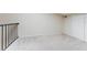 Upstairs loft features neutral carpet and a balcony with iron railing at 604 Chestnut Oak Cir # 106, Altamonte Springs, FL 32701
