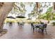 Outdoor patio area with brick pavers, patio furniture, and umbrellas for outdoor dining and relaxation at 604 Chestnut Oak Cir # 106, Altamonte Springs, FL 32701