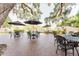 Outdoor patio area with brick pavers, patio furniture, and umbrellas for outdoor dining and relaxation at 604 Chestnut Oak Cir # 106, Altamonte Springs, FL 32701