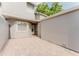 Private outdoor patio featuring stone pavers and neutral colored home exterior at 604 Chestnut Oak Cir # 106, Altamonte Springs, FL 32701
