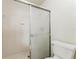Shower with a glass door is paired with a toilet for convenience at 604 Chestnut Oak Cir # 106, Altamonte Springs, FL 32701