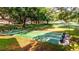 Shuffleboard courts are ready for play and shaded by mature trees at 604 Chestnut Oak Cir # 106, Altamonte Springs, FL 32701