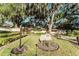 Community sign for Harbour Club on a manicured lawn with mature trees at 604 Chestnut Oak Cir # 106, Altamonte Springs, FL 32701