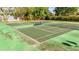 Outdoor tennis court perfect for friendly matches and enjoying the Florida sunshine at 604 Chestnut Oak Cir # 106, Altamonte Springs, FL 32701