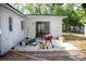 Backyard patio area with a grill and sliding glass door at 704 Beverly Ave, Altamonte Springs, FL 32701