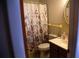 Cozy bathroom featuring a floral shower curtain, classic mirror and vanity at 704 Beverly Ave, Altamonte Springs, FL 32701