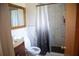 Nicely-appointed bathroom with marble tiles, shower, and dark wood vanity at 704 Beverly Ave, Altamonte Springs, FL 32701