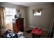Bedroom with dark dresser, computer, wood floors and two windows at 704 Beverly Ave, Altamonte Springs, FL 32701