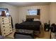 Bedroom features cozy furnishings, dark bedding, and good natural light at 704 Beverly Ave, Altamonte Springs, FL 32701