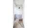 Covered entryway features a quaint, welcoming space with stone accents and an outdoor light fixture at 704 Beverly Ave, Altamonte Springs, FL 32701
