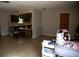 Open living space featuring wood-look floors, seamlessly connecting to the kitchen area at 704 Beverly Ave, Altamonte Springs, FL 32701