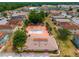 Aerial view showcasing a community pool and recreation area surrounded by lush trees and landscaping at 707 Michigan Ct # 2, St Cloud, FL 34769