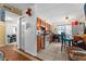 Eat-in kitchen featuring tile floors, wood cabinetry, a refrigerator, and plenty of storage space at 707 Michigan Ct # 2, St Cloud, FL 34769