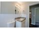 Neutral bathroom has a modern vanity with granite countertop, stylish mirror, and sleek tile work at 72 Campus View Dr, Orlando, FL 32810
