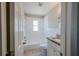 Bathroom with tiled shower and granite vanity at 72 Campus View Dr, Orlando, FL 32810