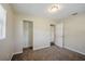 Carpeted bedroom with a closet, ceiling light, neutral walls, and a window for natural light at 72 Campus View Dr, Orlando, FL 32810