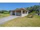 Charming single-story home featuring a carport, and well-maintained lawn at 72 Campus View Dr, Orlando, FL 32810