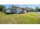 Charming single-story home showcasing a well-manicured lawn at 72 Campus View Dr, Orlando, FL 32810