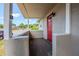Inviting front porch with a red door at 72 Campus View Dr, Orlando, FL 32810