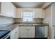 The eat-in kitchen has stainless appliances and plenty of counter space at 72 Campus View Dr, Orlando, FL 32810