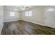 Bright living room with modern flooring, ceiling fan, and natural light at 72 Campus View Dr, Orlando, FL 32810
