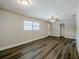 Bright living room with modern flooring, ceiling fan, and ample natural light at 72 Campus View Dr, Orlando, FL 32810