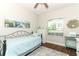 Cozy bedroom with a vintage aesthetic, featuring wood flooring, natural light, and decorative accents at 753 Grey Heron Pl, Chuluota, FL 32766