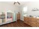Bright bedroom features wood floors, a ceiling fan, and a whimsical house-shaped bed at 753 Grey Heron Pl, Chuluota, FL 32766