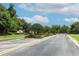 Welcoming community entrance of Osprey Lakes with lush landscaping and secure gate at 753 Grey Heron Pl, Chuluota, FL 32766