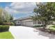 Charming home with a three-car garage and beautiful landscaping, enhancing curb appeal at 753 Grey Heron Pl, Chuluota, FL 32766