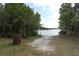 Picturesque view of the lake with a boat ramp access, perfect for outdoor activities at 753 Grey Heron Pl, Chuluota, FL 32766