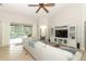 Bright and airy living room with pool view, high ceilings, and open floor plan at 753 Grey Heron Pl, Chuluota, FL 32766
