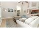 Spacious living room featuring a large sofa, high ceilings, and open layout at 753 Grey Heron Pl, Chuluota, FL 32766