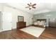 Spacious main bedroom featuring wood flooring, a ceiling fan, and ample natural light at 753 Grey Heron Pl, Chuluota, FL 32766