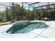 Heated in-ground pool and spill-over spa is enclosed in screened lanai and offers backyard views at 753 Grey Heron Pl, Chuluota, FL 32766