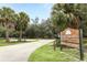 Scenic view of the Flagler Trail South trailhead with palm trees and lush greenery on a sunny day at 753 Grey Heron Pl, Chuluota, FL 32766