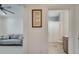 Bathroom view from the office, showcasing modern fixtures, tiled floors, and a shower with glass doors at 7651 Five Oaks Dr, Harmony, FL 34773