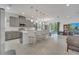 Spacious kitchen with an island, stainless steel appliances, and an adjacent dining area at 7651 Five Oaks Dr, Harmony, FL 34773
