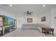 Spacious living room featuring recessed lighting, ceiling fan, and large-screen television at 7651 Five Oaks Dr, Harmony, FL 34773