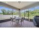 Screened patio with brick flooring, patio furniture and views of the backyard at 7651 Five Oaks Dr, Harmony, FL 34773