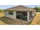 A view of the screened patio located on the back of the property at 7651 Five Oaks Dr, Harmony, FL 34773