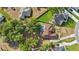 Aerial view of a home with a swimming pool and lots of trees at 841 Oaks Shores Rd, Leesburg, FL 34748