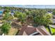 Aerial view of a backyard with a screened pool and mature trees at 841 Oaks Shores Rd, Leesburg, FL 34748