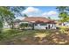 Backyard showcasing the screened pool area, perfect for entertaining or relaxing in the Florida sunshine at 841 Oaks Shores Rd, Leesburg, FL 34748
