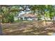 Expansive backyard with lush landscaping, and plenty of room for outdoor activities and relaxation at 841 Oaks Shores Rd, Leesburg, FL 34748